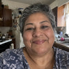 Selfie de una mujer salvadoreña de unos 45 años, sonriente.